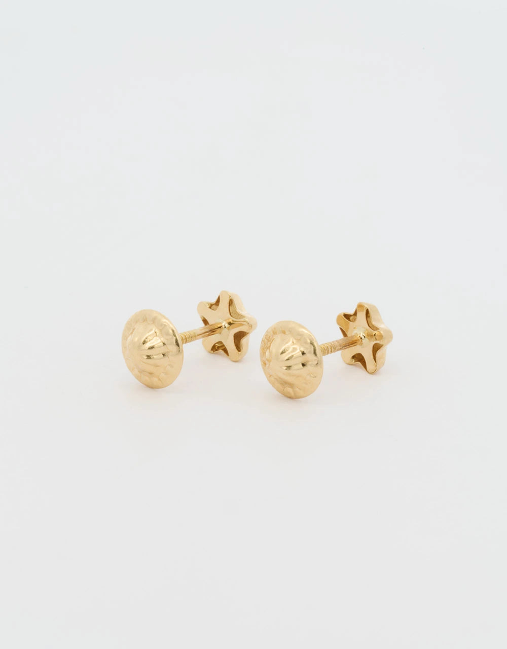 Topos mini estrellas en oro amarillo 18k