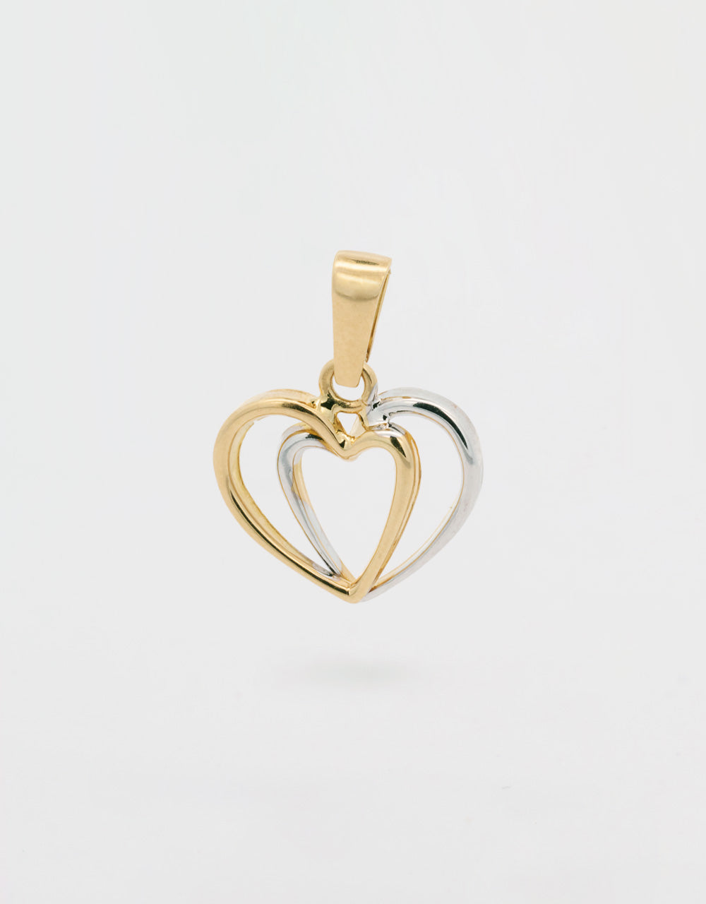 Dije doble corazón en dos oros 18k