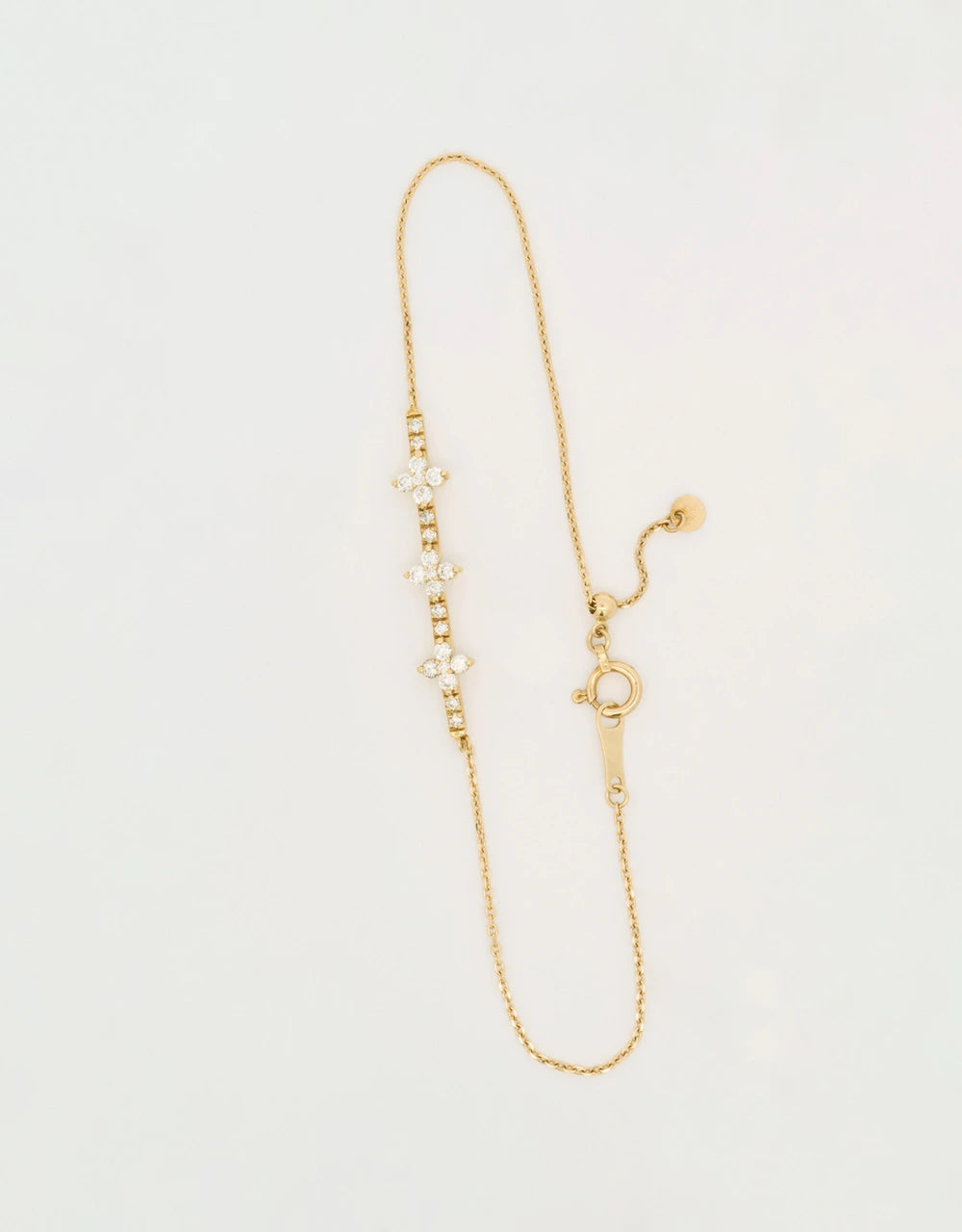 Pulsera barra cruces de diamantes en oro amarillo de 18k