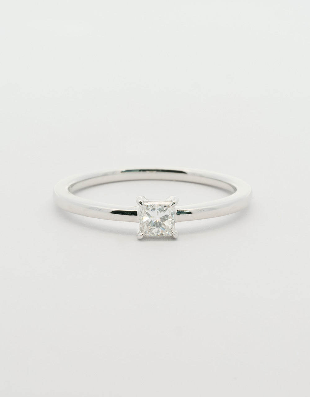 Anillo diamante central princess 0,25 quilates oro blanco 18k