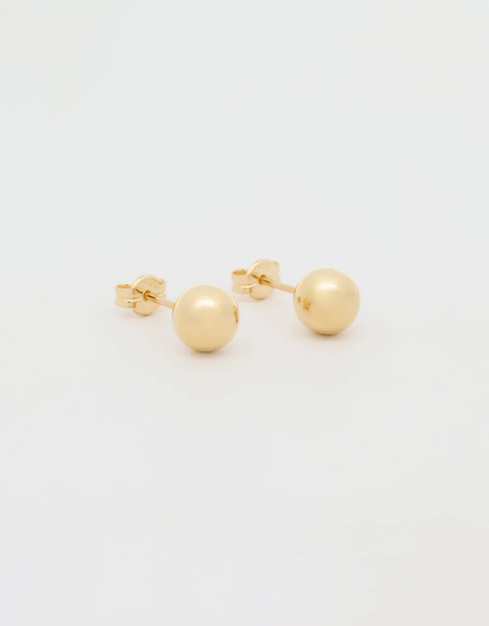 Topos esféricos en oro amarillo 18k
