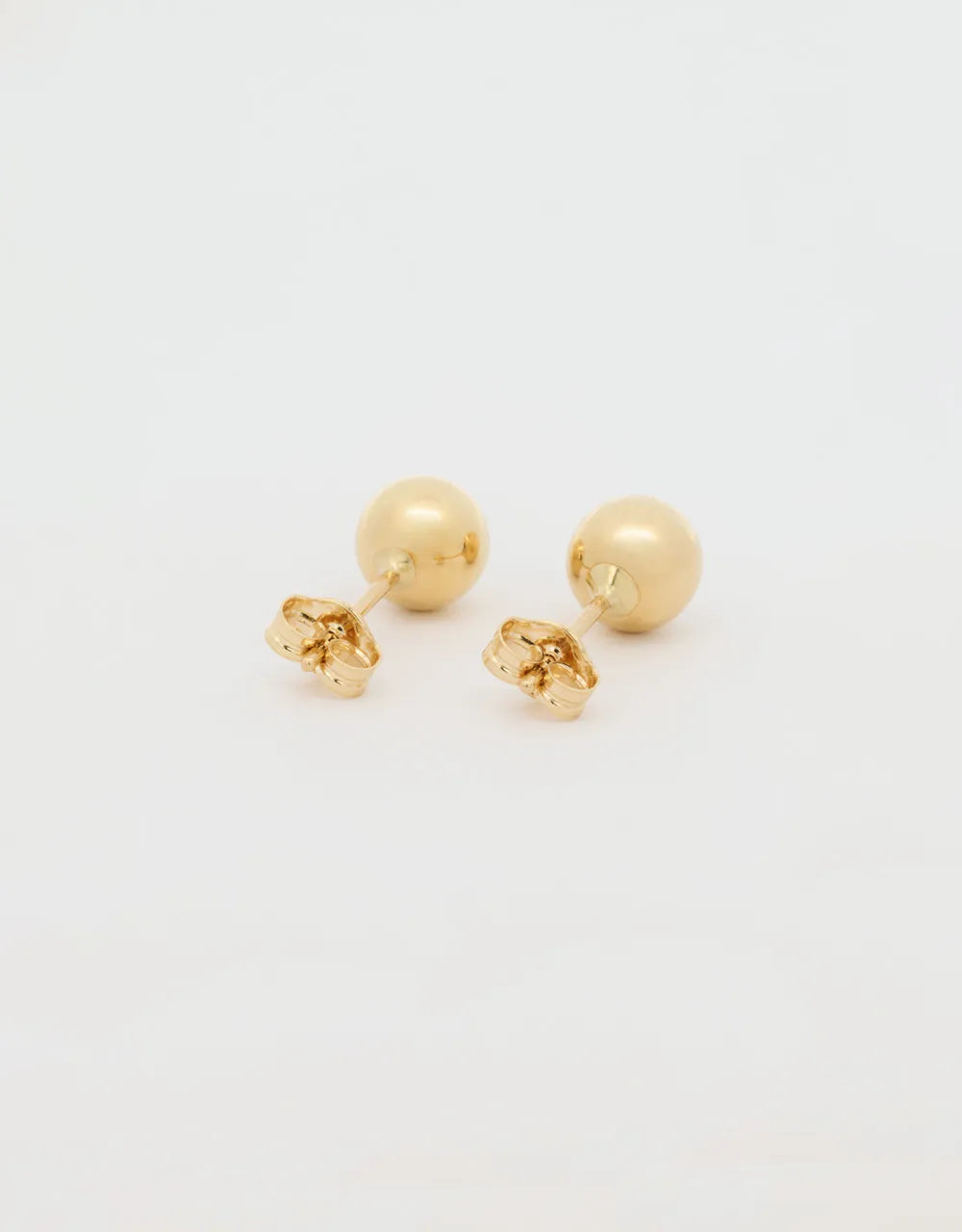 Topos esféricos en oro amarillo 18k
