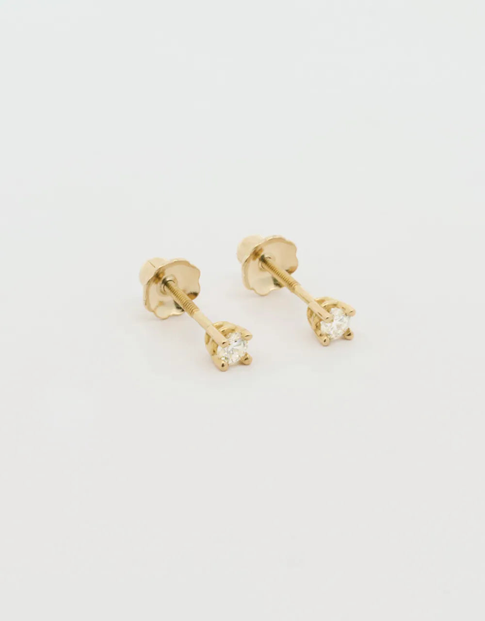 Topos de diamantes 0.10 quilates en oro amarillo 18k