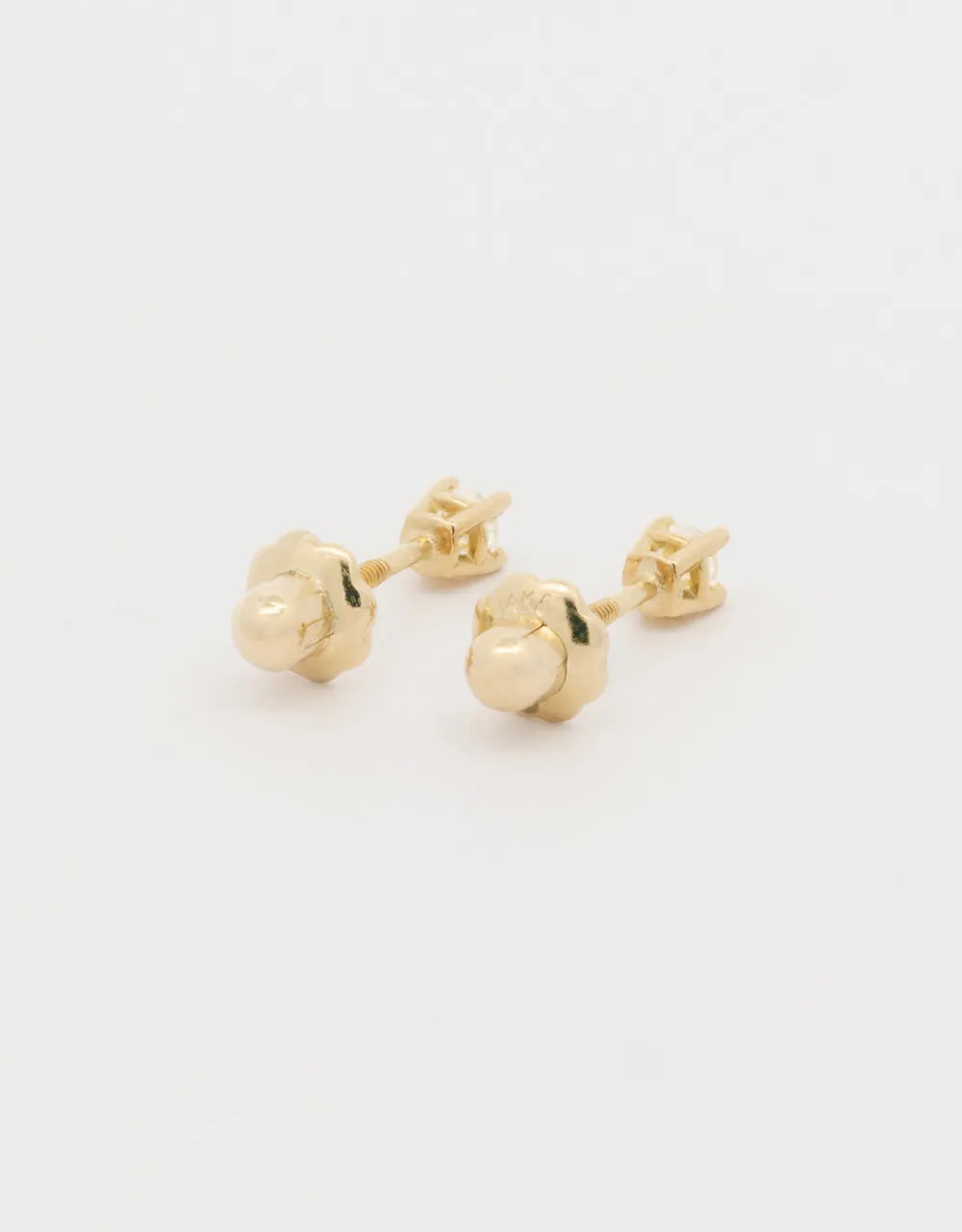 Topos de diamantes 0.10 quilates en oro amarillo 18k