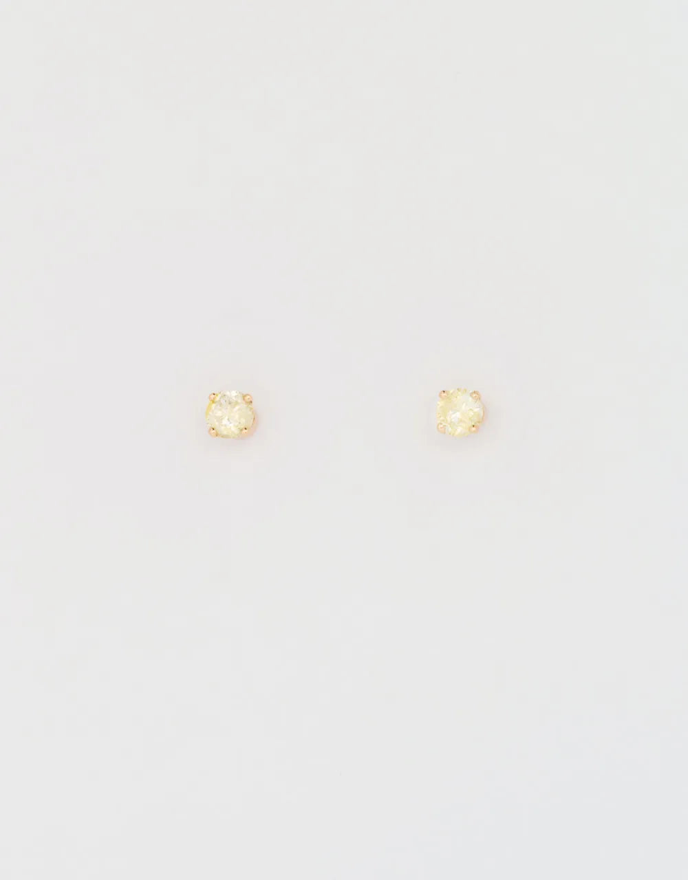 Topos de diamante amarillo 0.19 quilates en oro rojo 18k