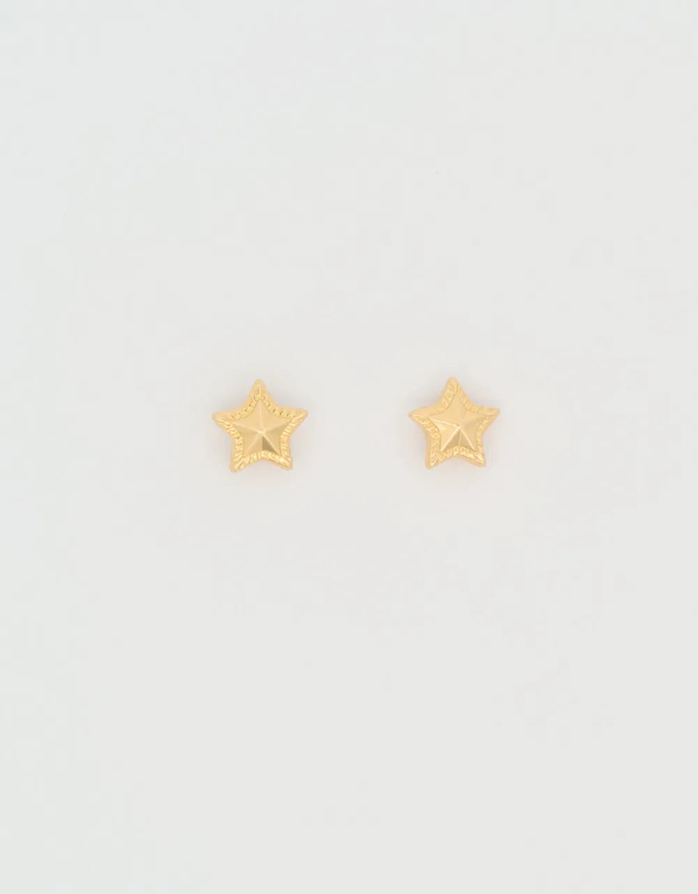 Topos estrella en oro amarillo de 18k