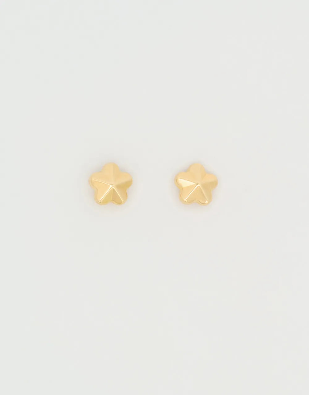 Topos mini estrella en oro amarillo de 18k