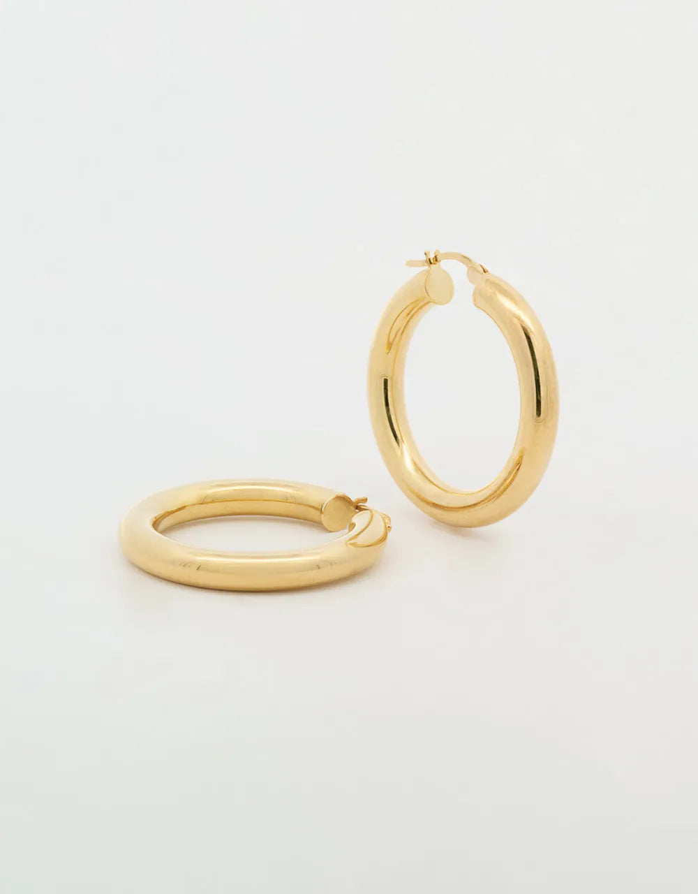 Candongas redondas lisas en oro amarillo 18k
