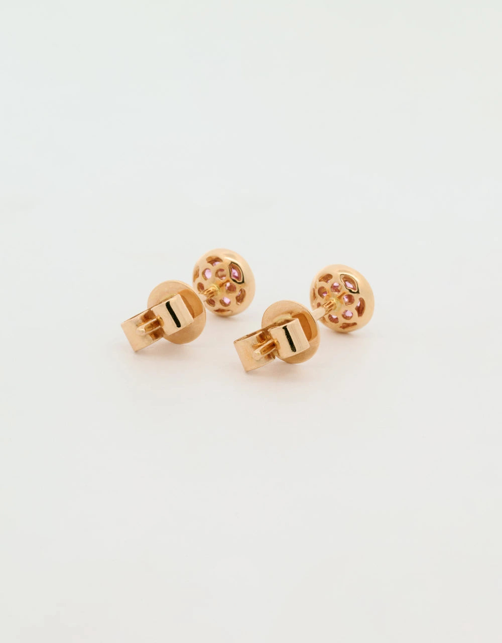 Topos de zafiros rosados en oro rojo 18k