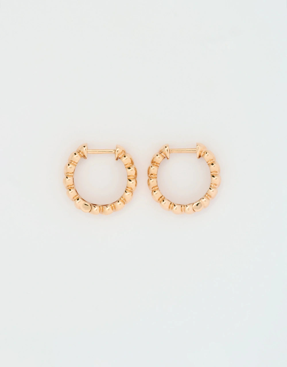Candongas de corazones en oro rojo 18k