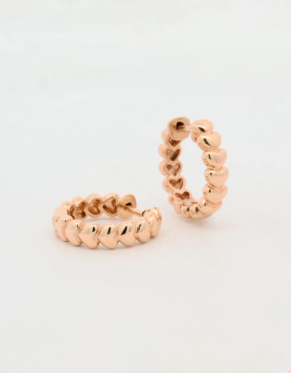 Candongas de corazones en oro rojo 18k