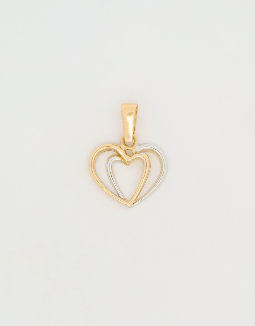 Dije doble corazón en dos oros 18k