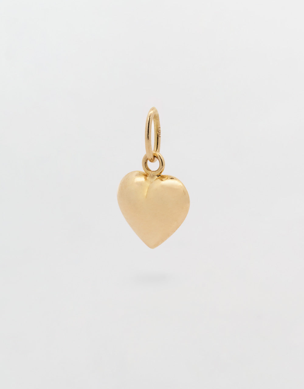 Dije mini corazón en oro amarillo 18k