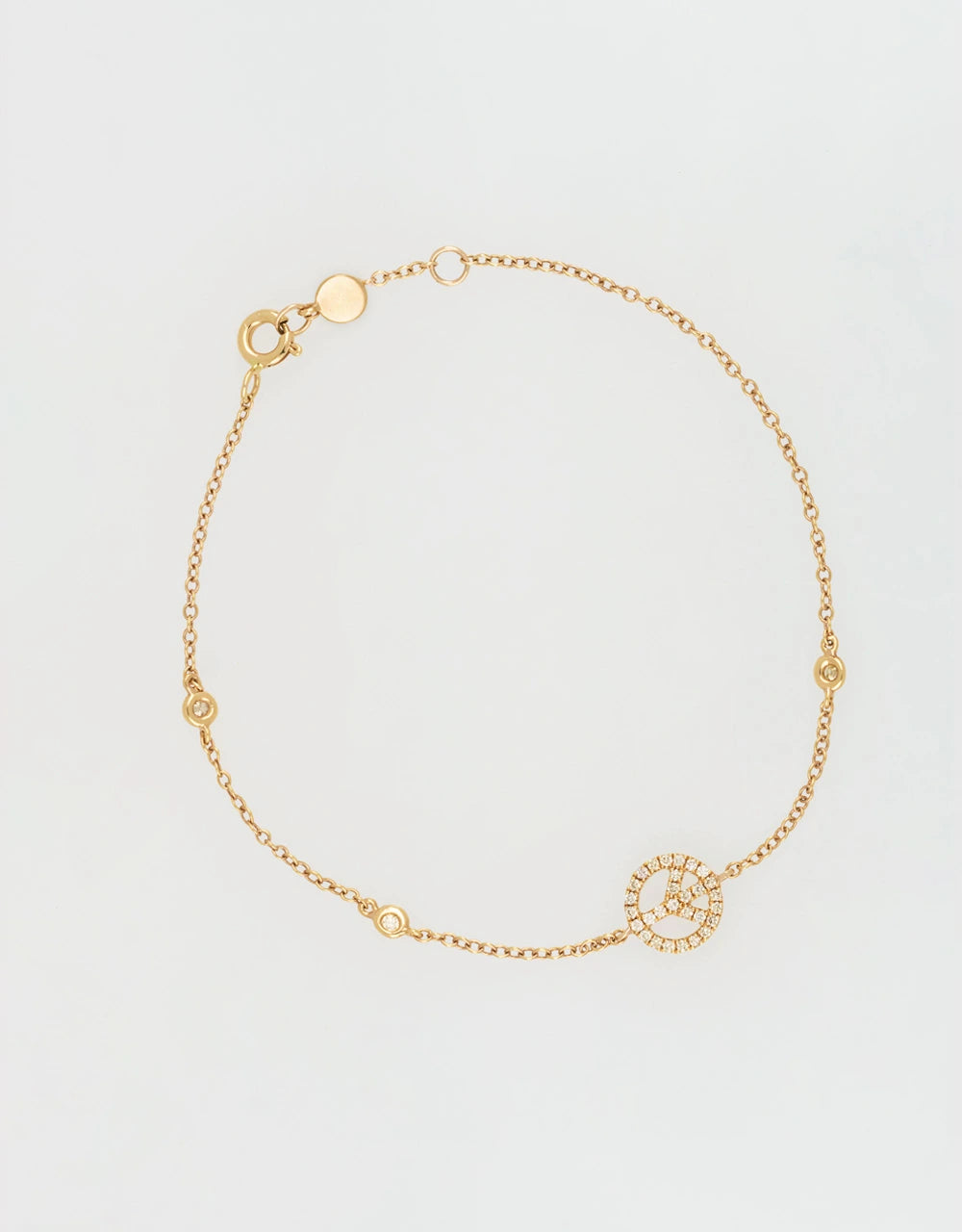 Pulsera símbolo paz de diamantes en oro rojo de 18k