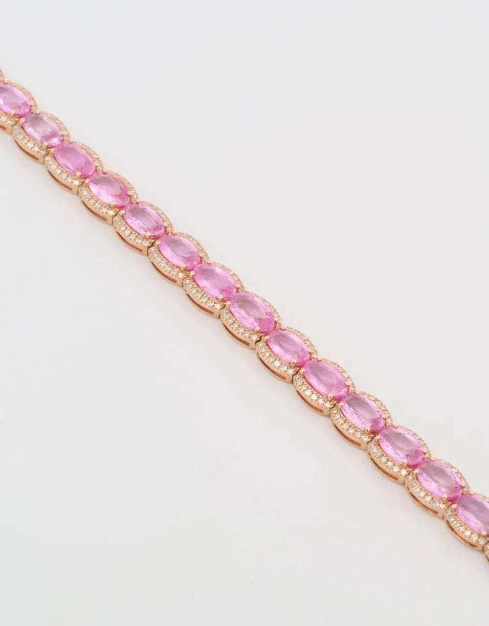 Pulsera de zafiros rosados con diamantes en oro rojo de 18k