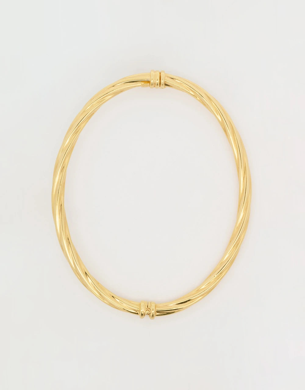 Pulsera brazalete de hilos entrelazados en oro amarillo de 18k